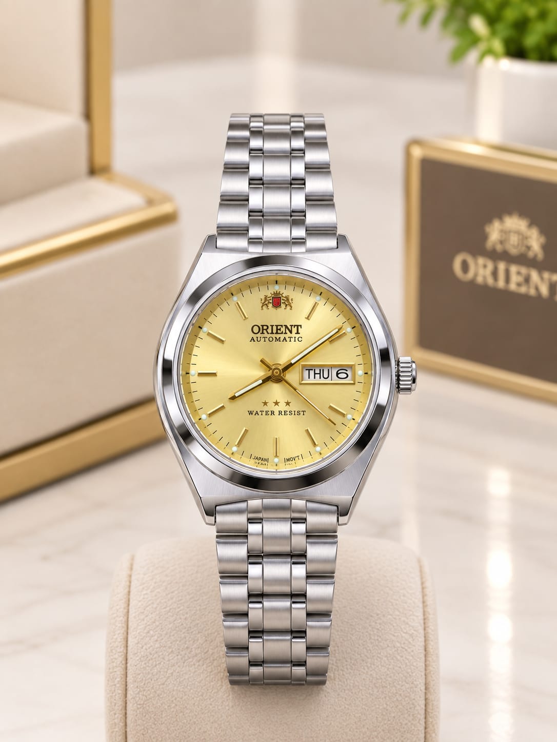 Relógio Orient automático feminino prateado com mostrador dourado e calendário - Resistente à água